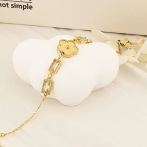 Gold clover charm stainless steel bracelet with rectangular zircon stones on white clouds