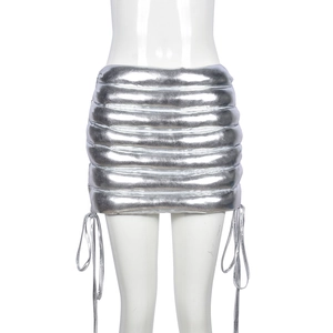 Detail of silver quilted metallic mini skirt with adjustable side drawstring feature