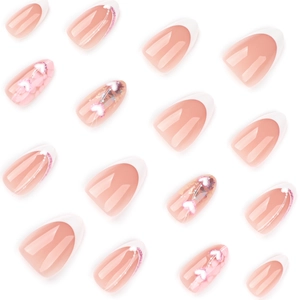 French tip press-on nails with pink gradient, white hearts and subtle pink glitter accents
