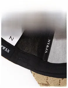 Detail of baseball cap interior showing wide sweatband with logo and breathable mesh liner