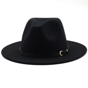Detail of black fedora hat featuring wool felt texture and a golden metal belt buckle