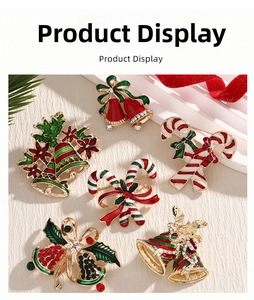 Detailed view of Christmas brooches with festive red and green enamel and crystal accents