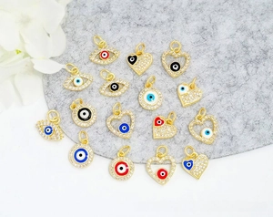 Macro shot of 18K gold plated evil eye charms with cubic zirconia for DIY jewelry