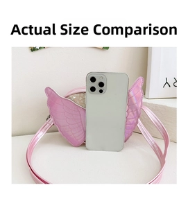 Size comparison of pink girls sequin crossbody bag with wings next to a smartphone