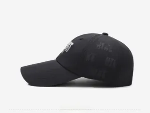 Detailed side view of quick-dry baseball cap with letter embroidery and laser-cut vents