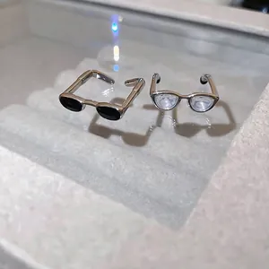 Y2K style silver metal glasses shaped open rings with black and clear lenses