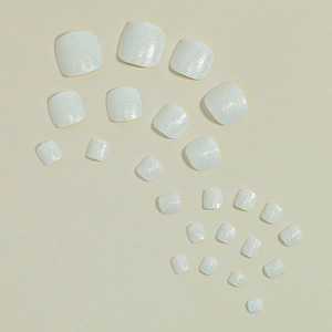Sparkly white glitter press-on toenails in a square shape with 24 count for women