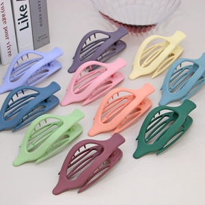 Set of 10 matte leaf-shaped hair claws in various colors for elegant hairstyling
