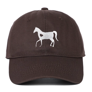 Close-up of white heart and horse embroidery on a dark brown cotton baseball cap