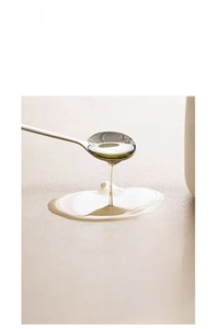 Close-up of beige leather table mat showing waterproof and stain resistant surface