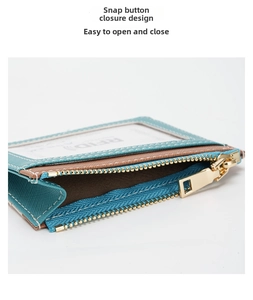 Detail of color-block RFID card holder featuring zipper pocket and press stud closure