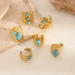 Set of six vintage bohemian gold rings with turquoise stones and textured engravings