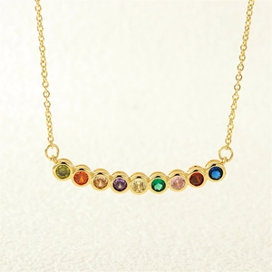 Macro shot of 18K gold-plated chain with nine colorful rainbow zircon gemstones