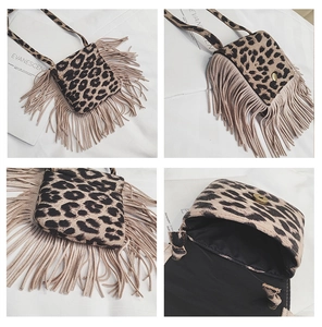 Detail view of leopard print kids crossbody bag with fringe tassels and magnetic closure
