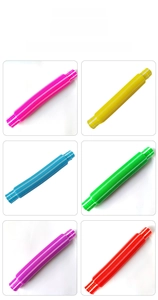 Colorful pop tubes collection showing pink yellow blue green purple and red sensory toys