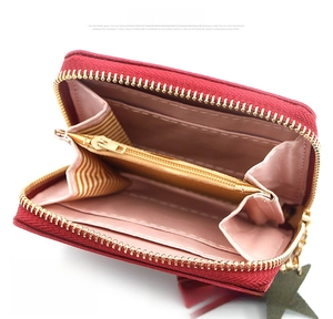 Detailed interior of the heart zip wallet showing pink lining and yellow compartments