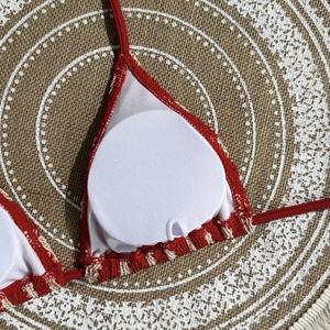 Detail of bikini top showing breathable mesh lining and removable round breast pads