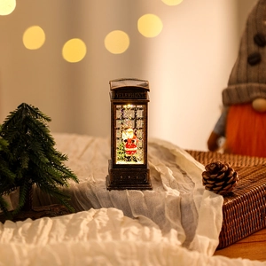 Macro shot of vintage bronze telephone lantern with Santa Claus and festive glitter