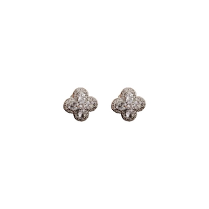 Silver flower stud earrings featuring sparkling cubic zirconia in a minimalist quatrefoil design