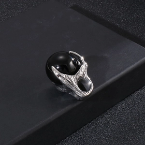 Gothic punk silver dragon claw pendant with a large polished black gemstone sphere