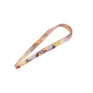 Minimalist U-shaped acetate hair pin with colorful marble pattern and polished finish