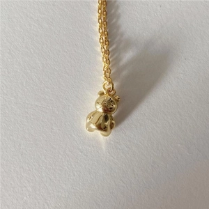925 sterling silver bear pendant necklace with a polished gold finish and cable chain