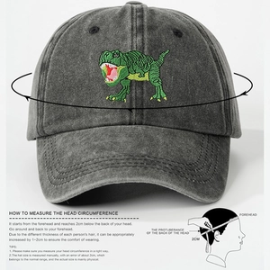 Dark grey washed denim baseball cap with green dinosaur embroidery and head size guide