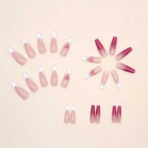 Long ballerina press-on nails with white French tips, pink butterflies, and purple glitter