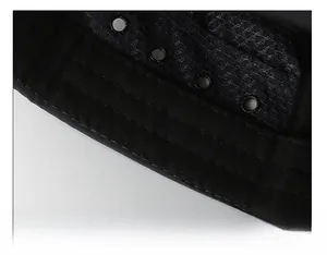 Detail of black sun hat featuring reinforced stitching and metal eyelets for breathability
