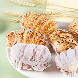 Realistic artificial bread and cupcakes in paper holders for bakery shop decoration