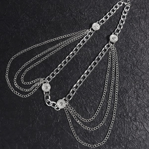 Detail view of multi-layer silver metal waist chain with embossed round pendants