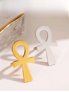 Macro view of gold and silver Ankh cross rings with high-polished mirror finish