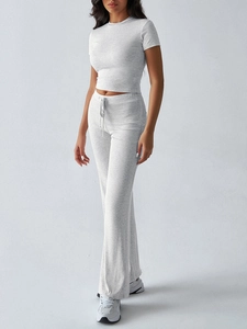 Detail of grey crewneck T-shirt and drawstring high-waist wide-leg pants for women