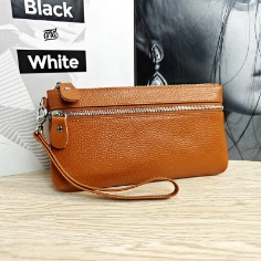 Brown textured genuine leather coin purse with double zipper pockets and wrist strap detail