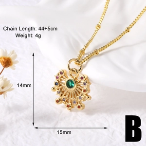 Macro shot of gold-plated sunburst necklace with colorful zircon stones on white fabric