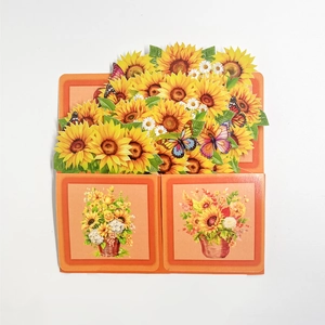 Detail of 3D sunflower pop-up greeting card with floral basket and butterfly