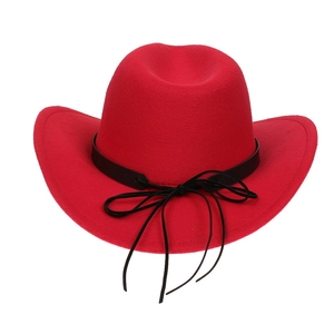 Detailed view of red felt western cowboy hat with black decorative ribbon and bow