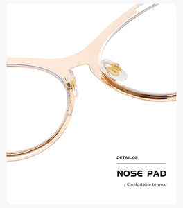 Close-up of adjustable nose pads on gold metal butterfly frame anti-blue light glasses