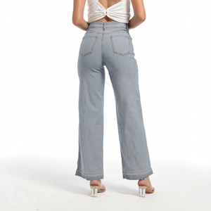 Rear view of high-waisted light blue denim jeans with back pockets and frayed hem details