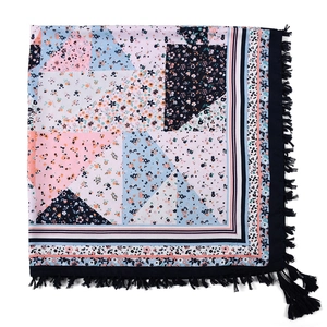 Close-up of bohemian floral square scarf with intricate patterns and dark blue tassels