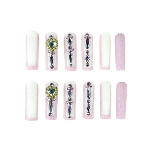 Pink heart glitter press-on nails in long coffin shape with rhinestones on white base