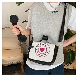 Creative vintage telephone crossbody bag with heart dial and functional handset prop