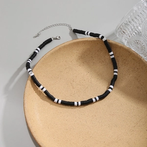 Minimalist black and white clay disc necklace for men with silver metal extender chain