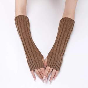 Close-up of deep brown cable-knit arm warmers with detailed braided pattern and fingerless design
