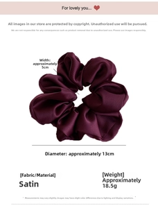 Macro detail of dark purple satin scrunchie showing 13cm diameter and silk texture