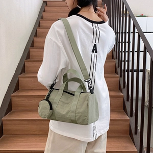 Minimalist light green cylinder handbag for women with mini round coin purse and shoulder strap