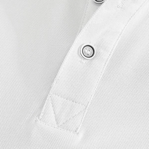 Detail of white piqué cotton polo shirt collar with matching white buttons and stitching
