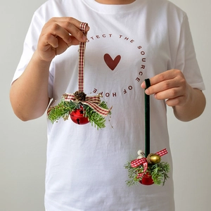 Christmas iron bells with pine cones and red bows hanging ornaments for festive tree decor