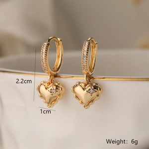 Detail view of gold plated heart drop earrings with dimensions 2.2cm height and 6g weight