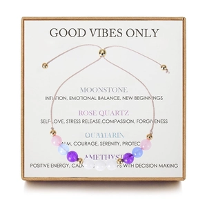 Detail of beaded gemstone bracelet with crystal meaning card in a gift box packaging